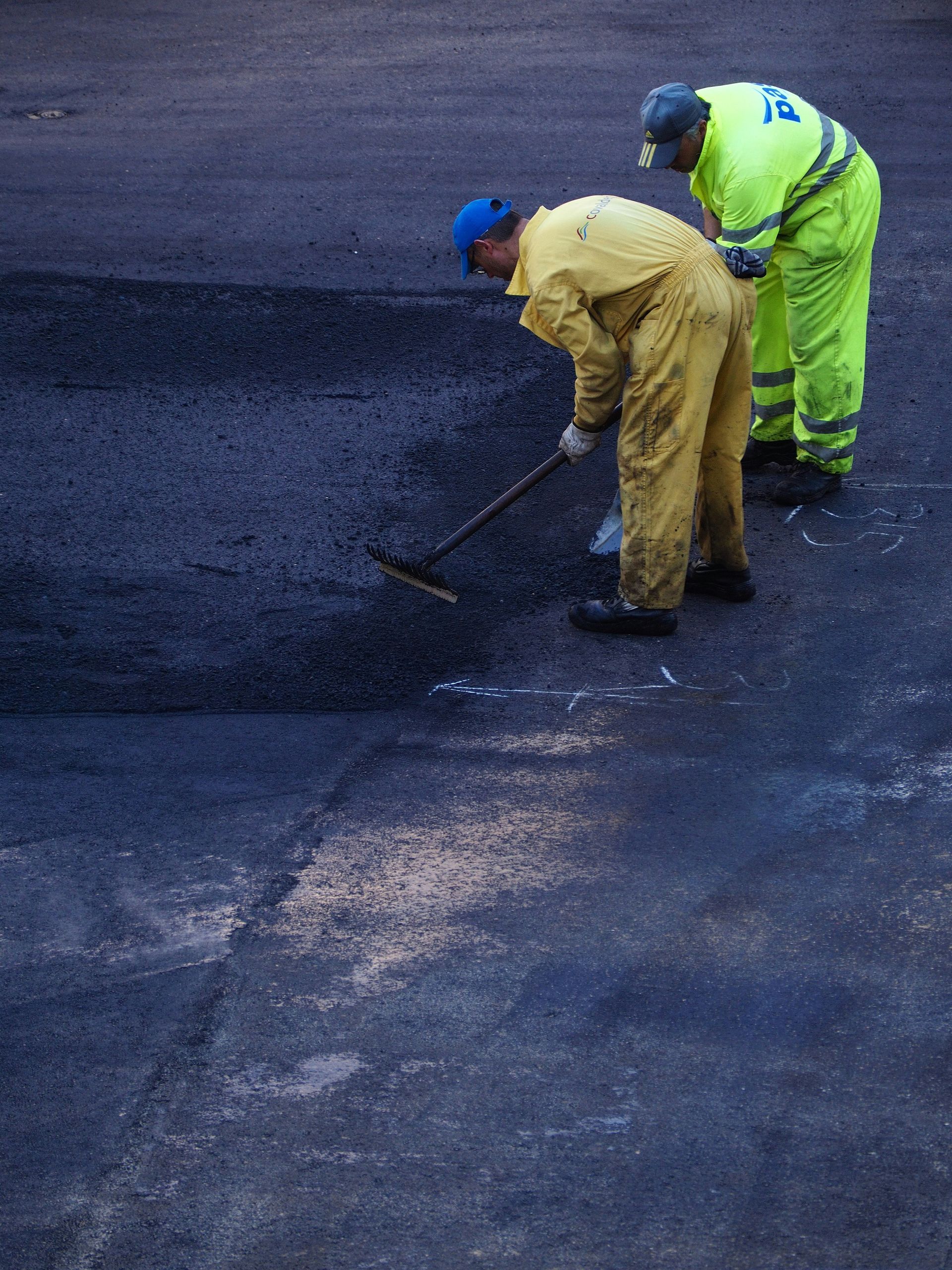 Crew spreading asphalt