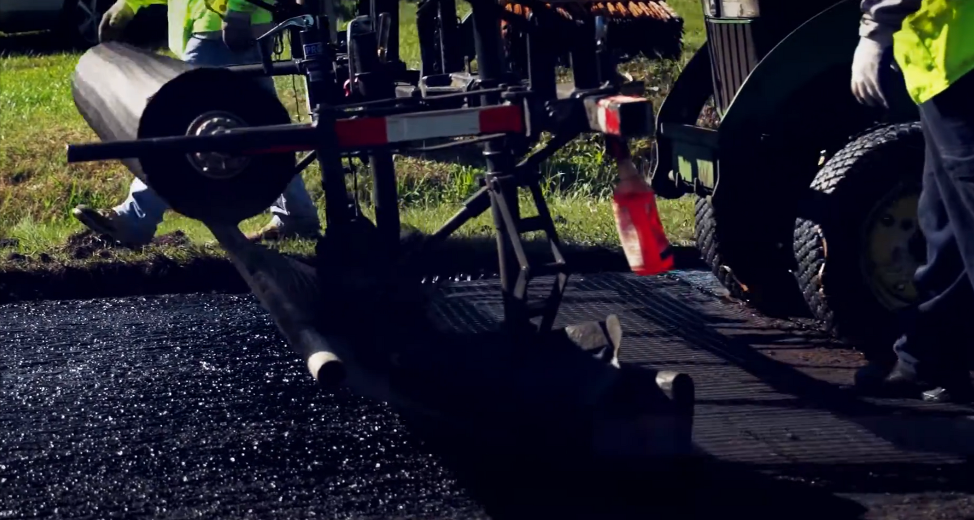 Fresh asphalt being paved