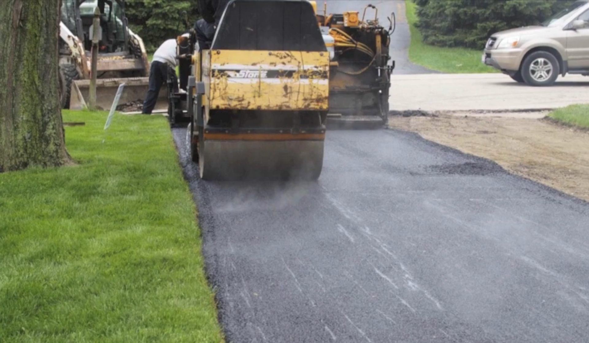 Crew rolling asphalt