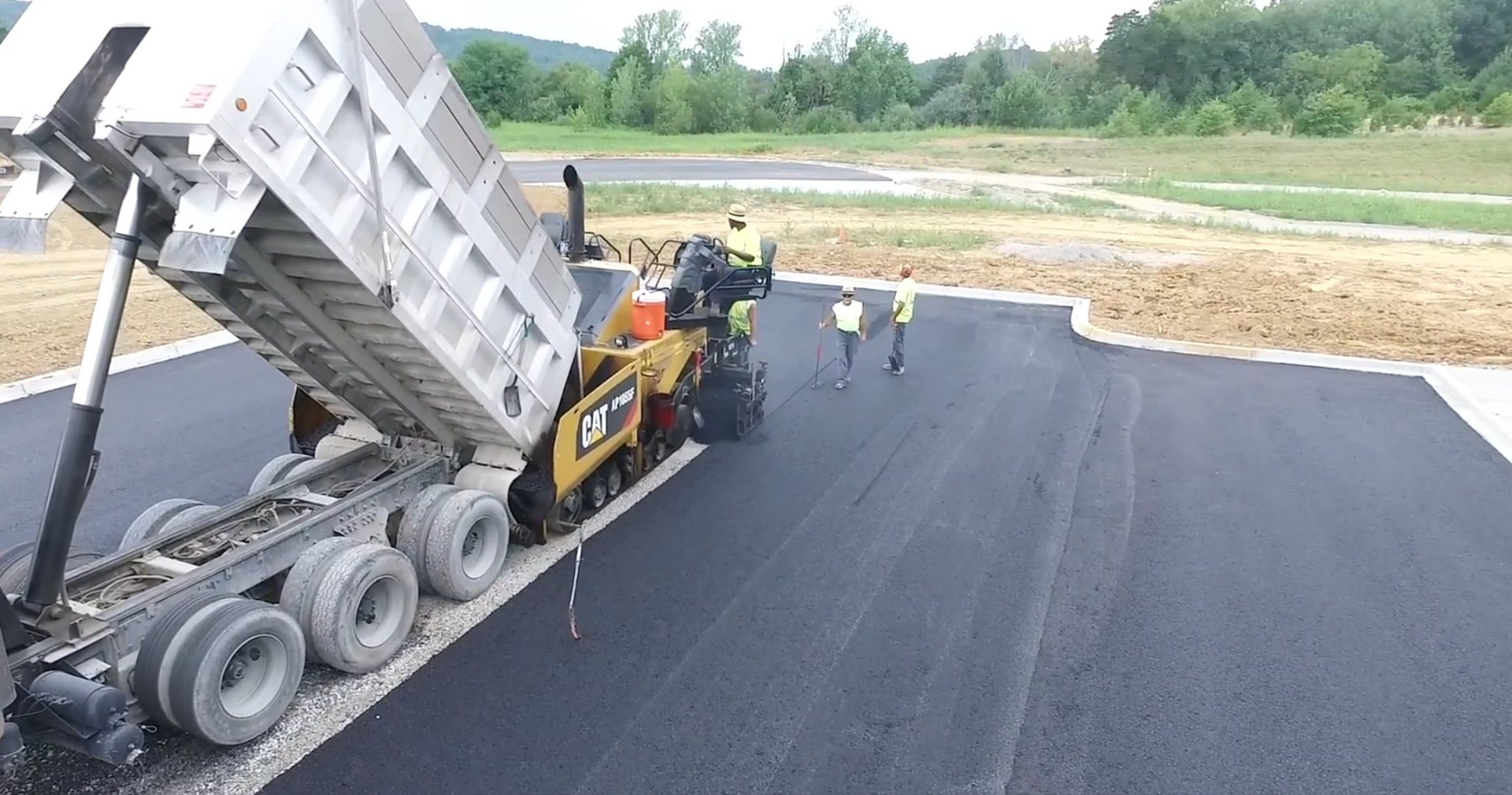 Crew replacing asphalt on parking lot
