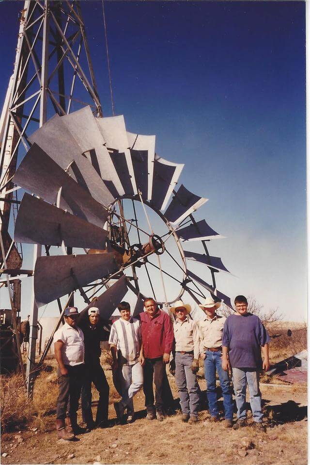 skinner's workers standing with windmill - Brewster County, Presidio County, Jeff Davis County, Pecos County, Reeves County, Terrell County