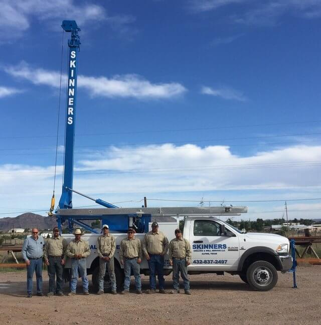 workers posing with Skinner's water well drilling truck - Brewster County, Presidio County, Jeff Davis County, Pecos County, Reeves County, Terrell County