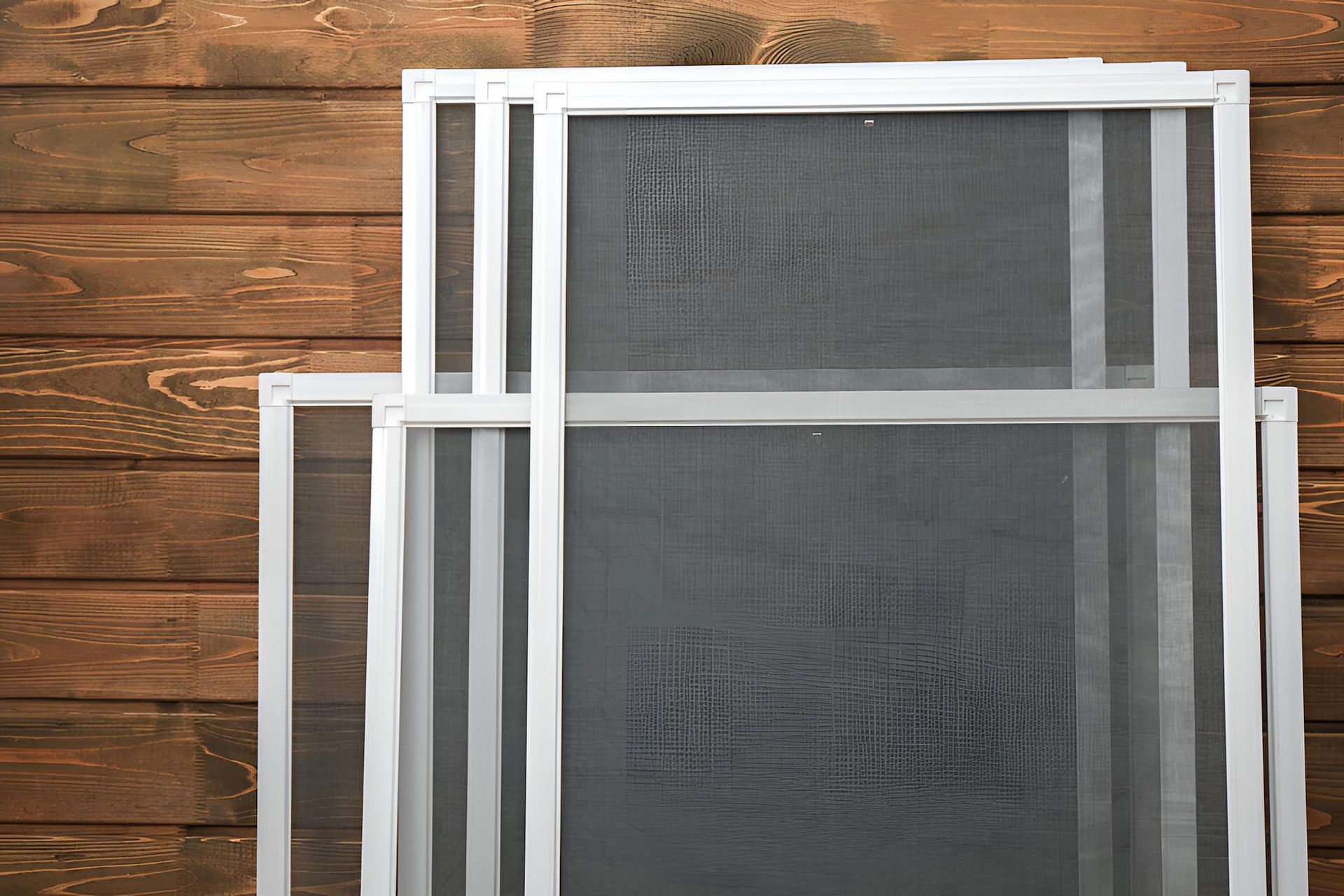 A Window With a Metal Mesh Covering It — Manning Blinds & Awnings in Taree, NSW