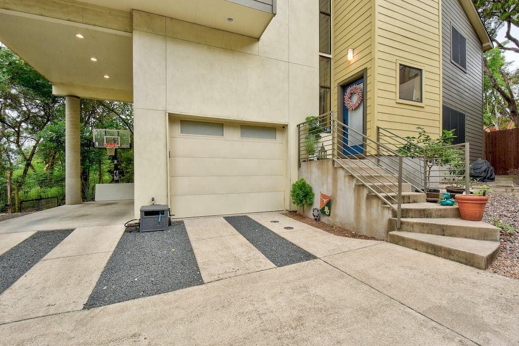 A house with a basketball hoop in front of it