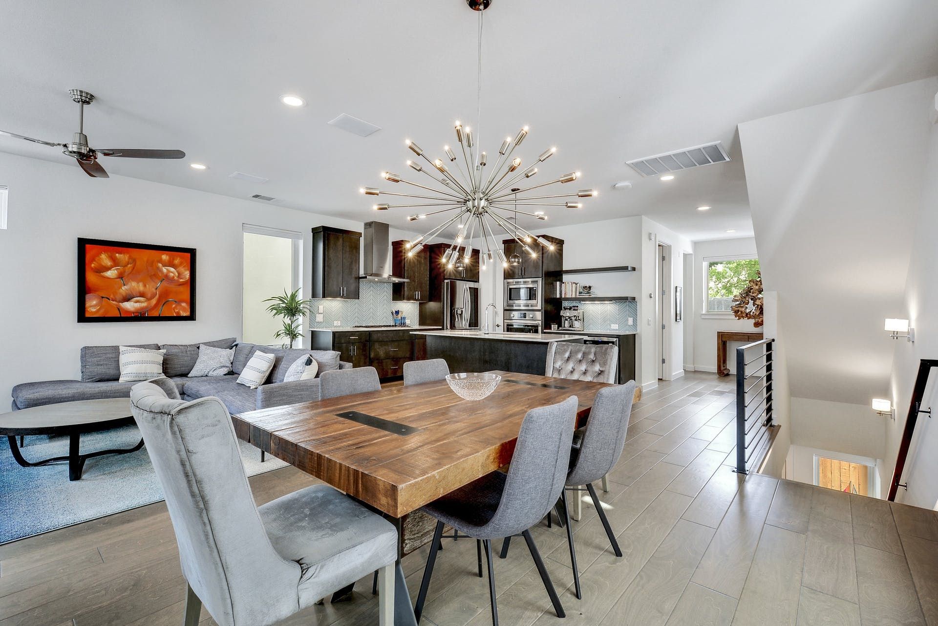 There is a dining table and chairs in the middle of the room.