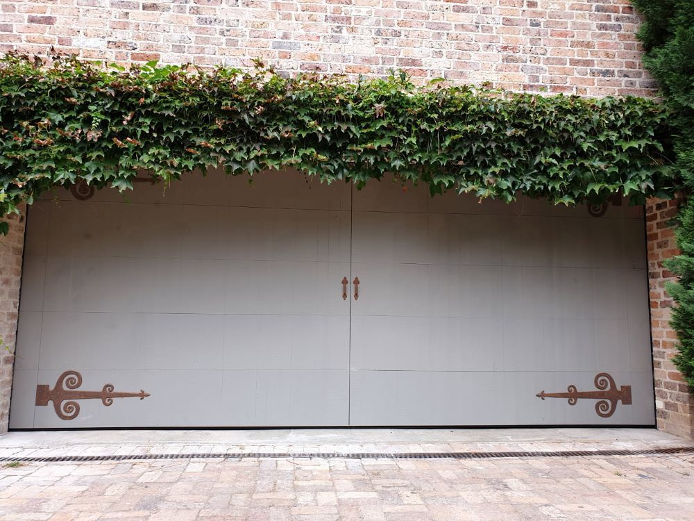 A Custom Garage Door With Ivy Growing Over It — Schofield's Garage Doors in Robertson, NSW