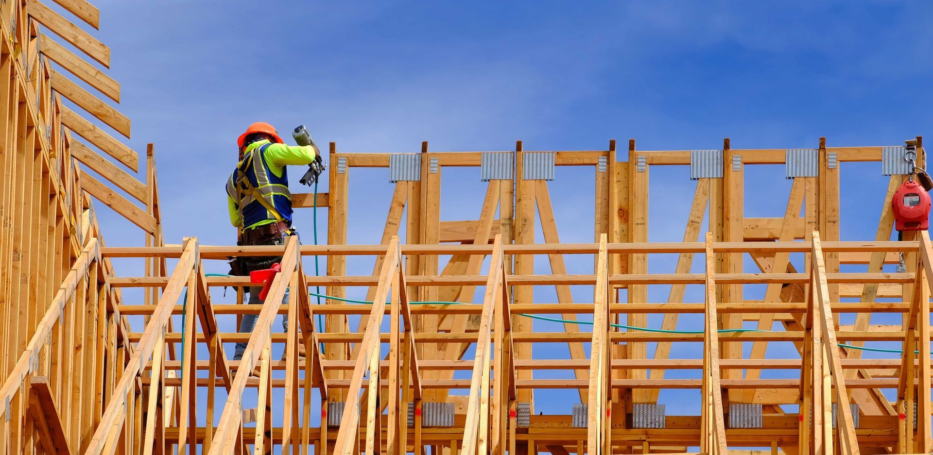 A group of construction workers are working on a wooden structure.