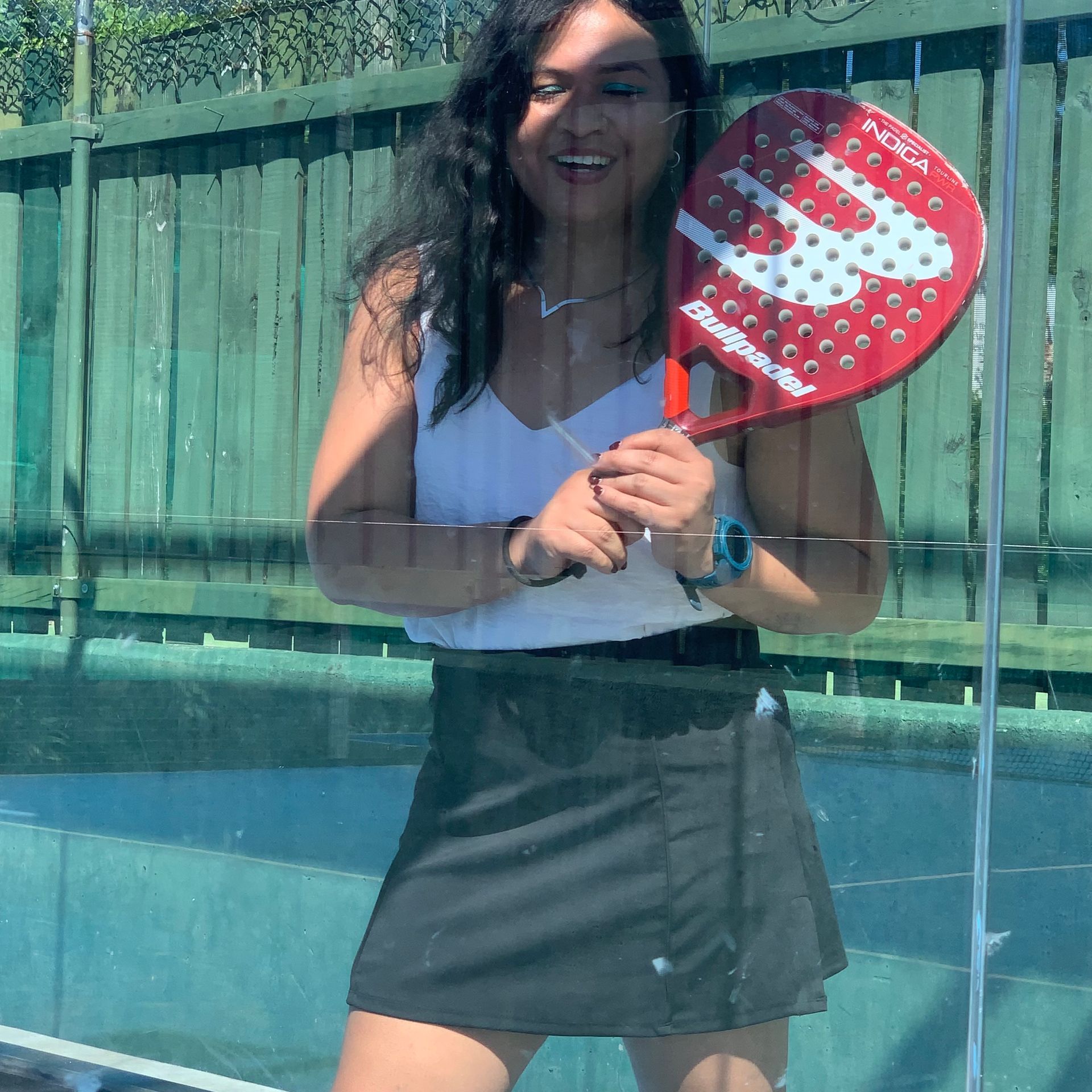 A woman is doing a handstand on a set of stairs