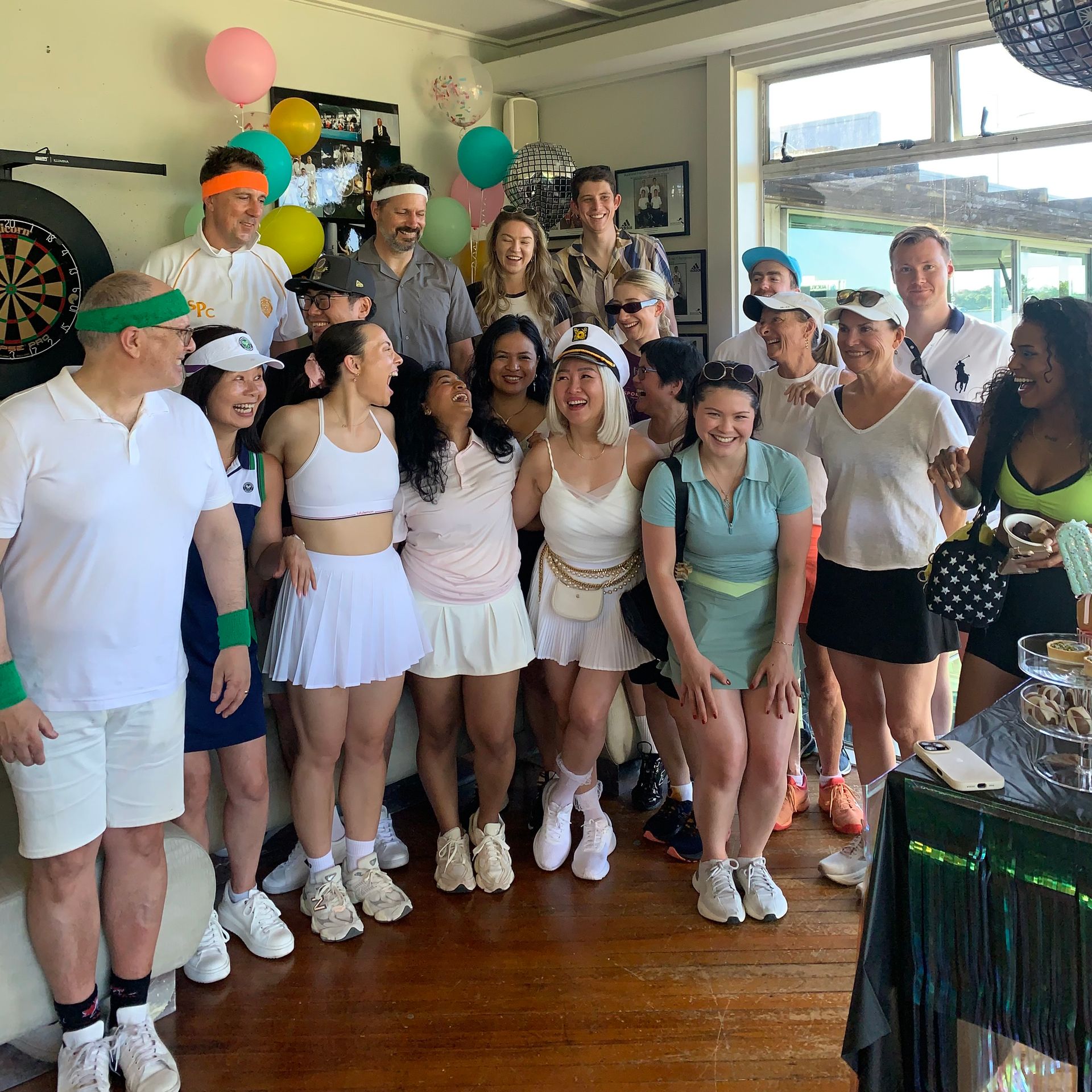 A woman is kneeling on a yoga mat next to a chair