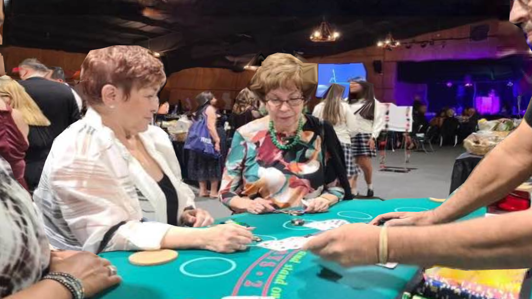 A group of people are sitting at a table playing a game of poker.