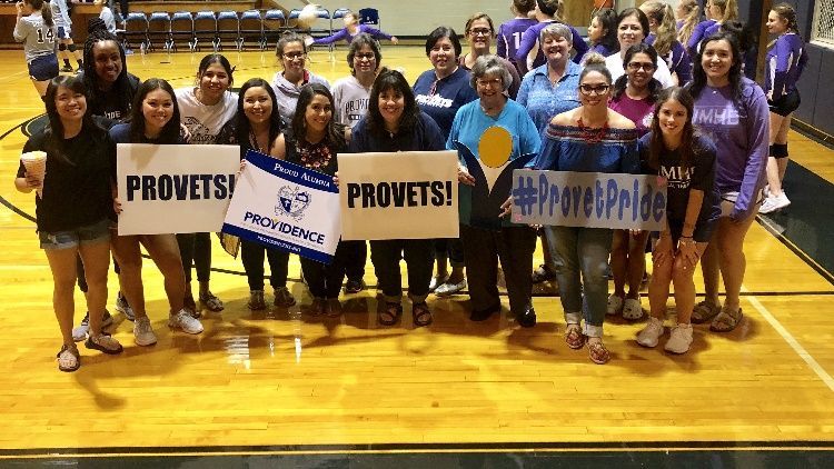 A group of people holding signs that say provets