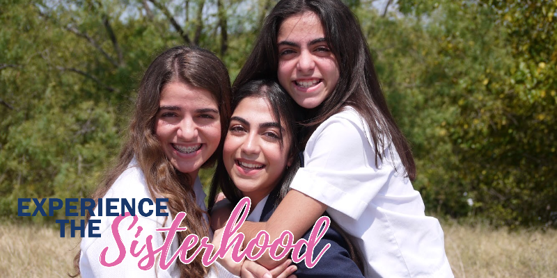 Three girls hugging each other with the words experience the sisterhood in the background