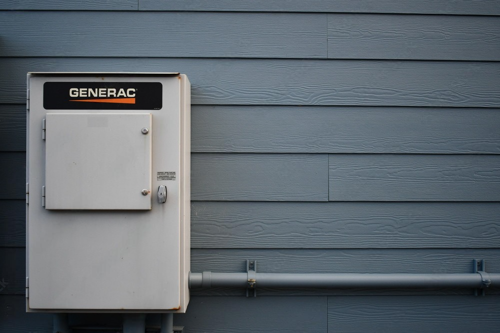 a generator box is attached to the side of a house .