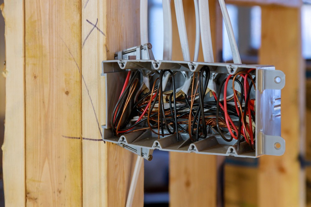 Close-up view of multiple electrical breaker boxes arranged neatly within a solar power plant facility.