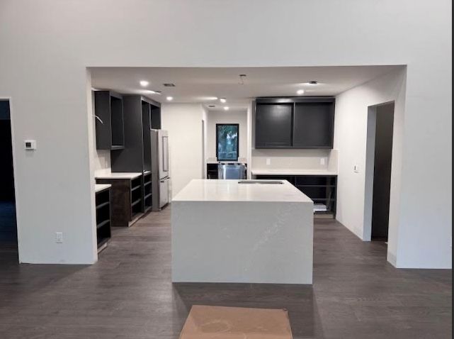 A kitchen with a large island in the middle of it