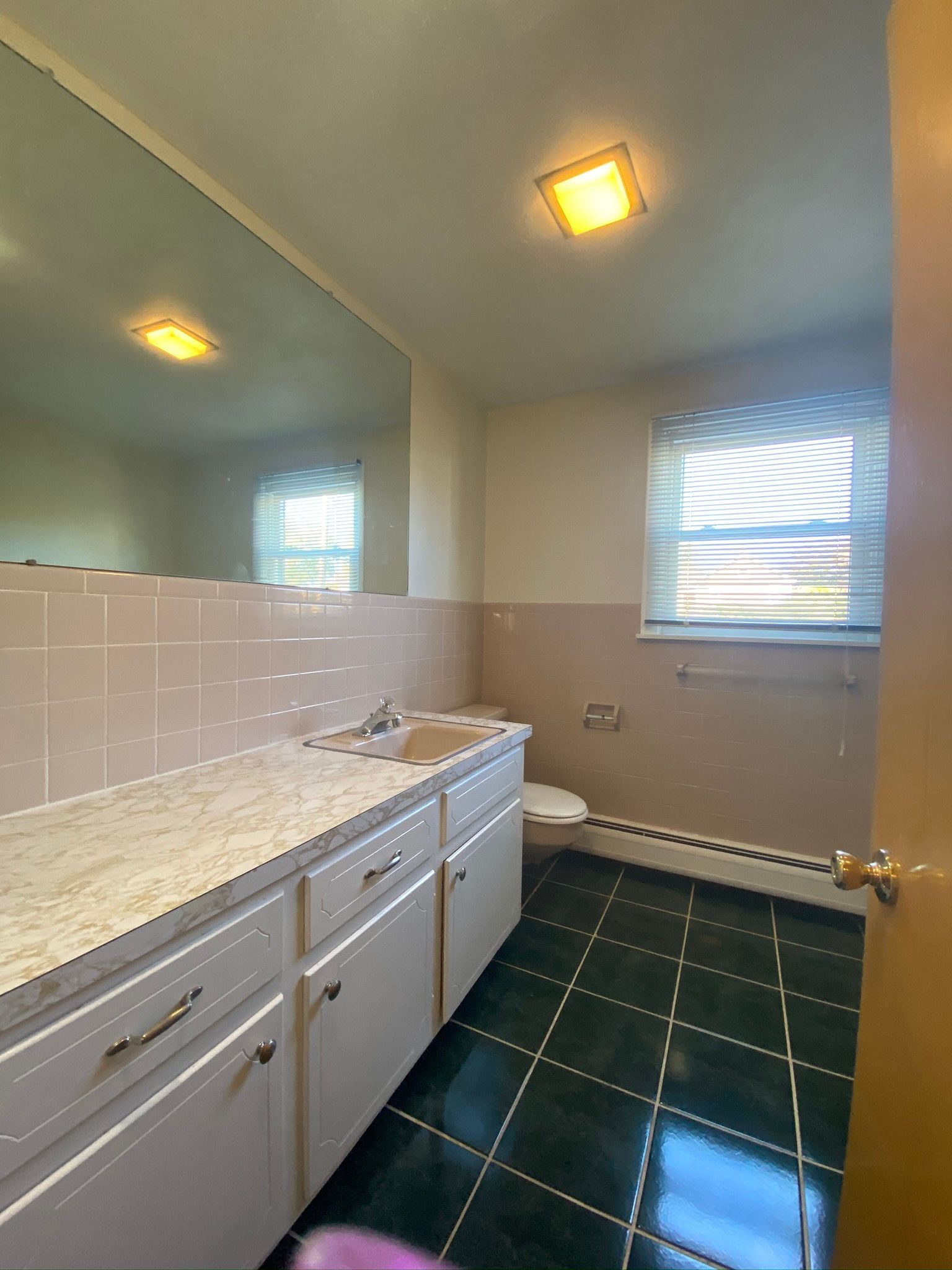 Bathroom with green tile flooring — Vernon, CT — A1 Properties