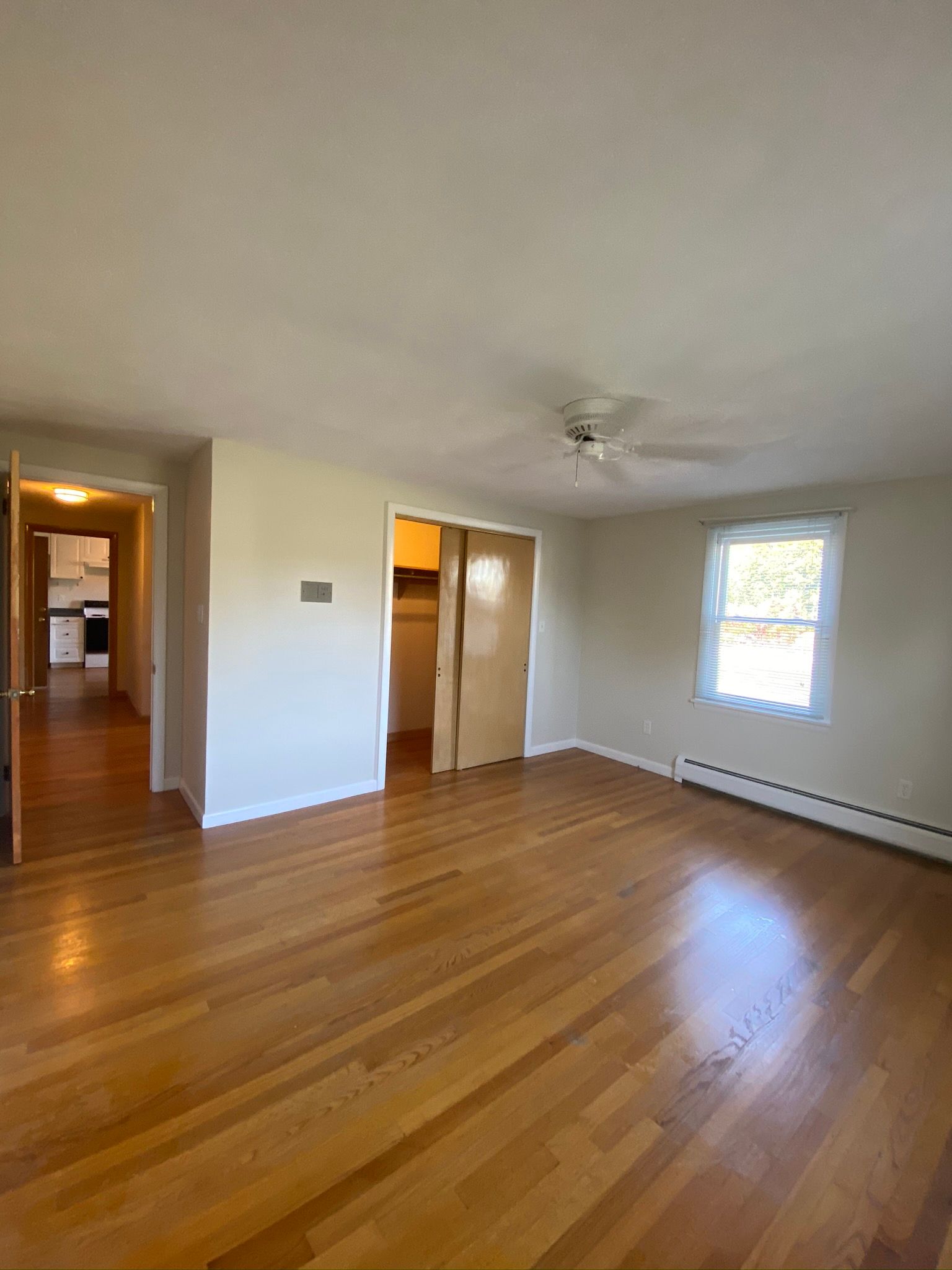 Room with wooden flooring and ceiling fan — Vernon, CT — A1 Properties