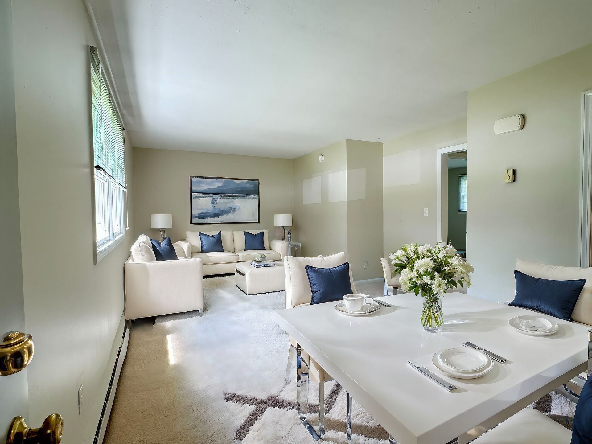 A living room with a dining table and chairs and a couch — Vernon, CT — A1 Properties