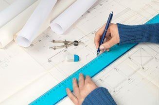 Surveying Services — Hand Holding A Drawing Pen in Latham, NY