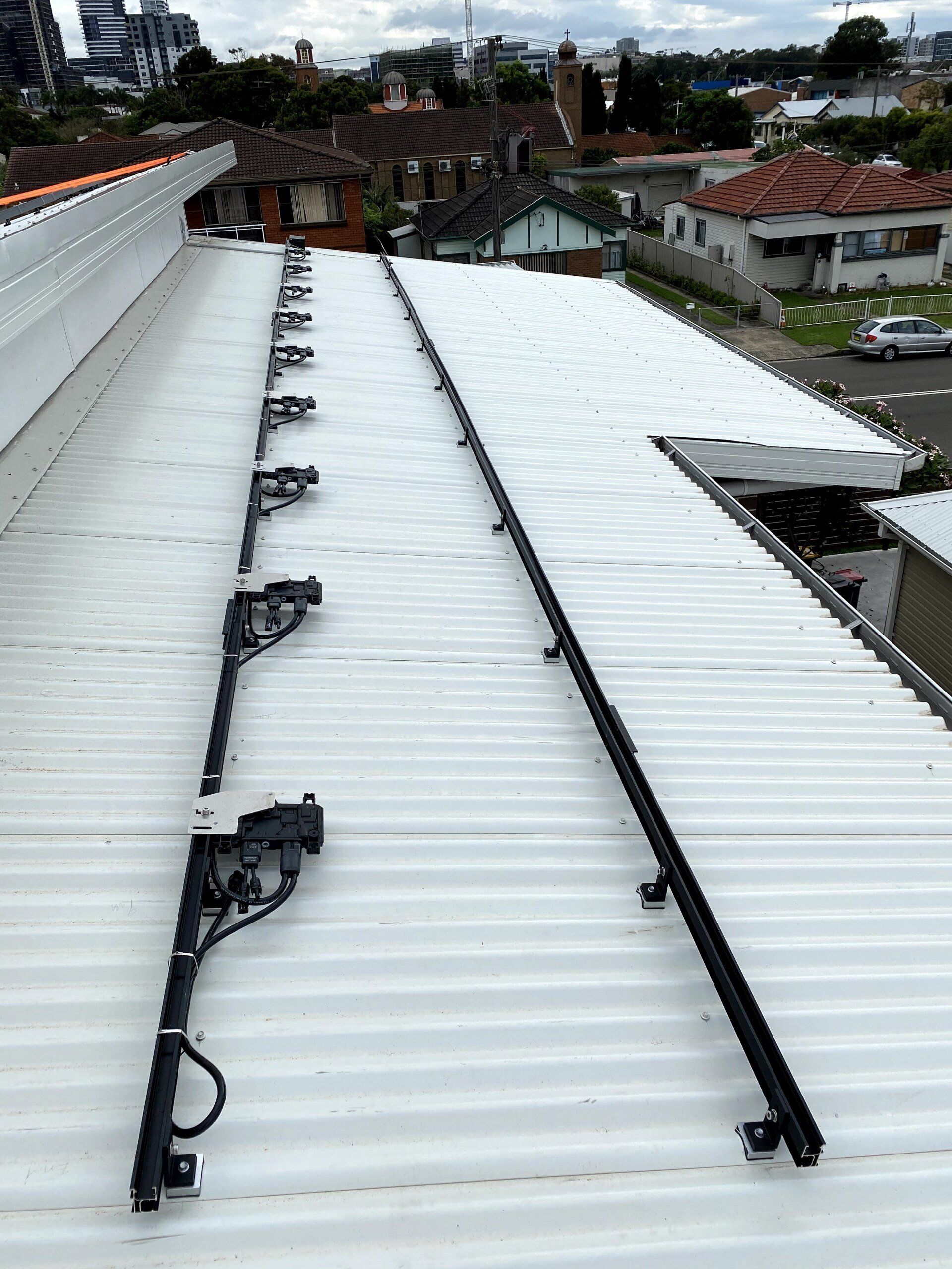 Before Installed New Solar Panels System On The White Roof — Servicing Homes & Businesses in Albion Park, NSW