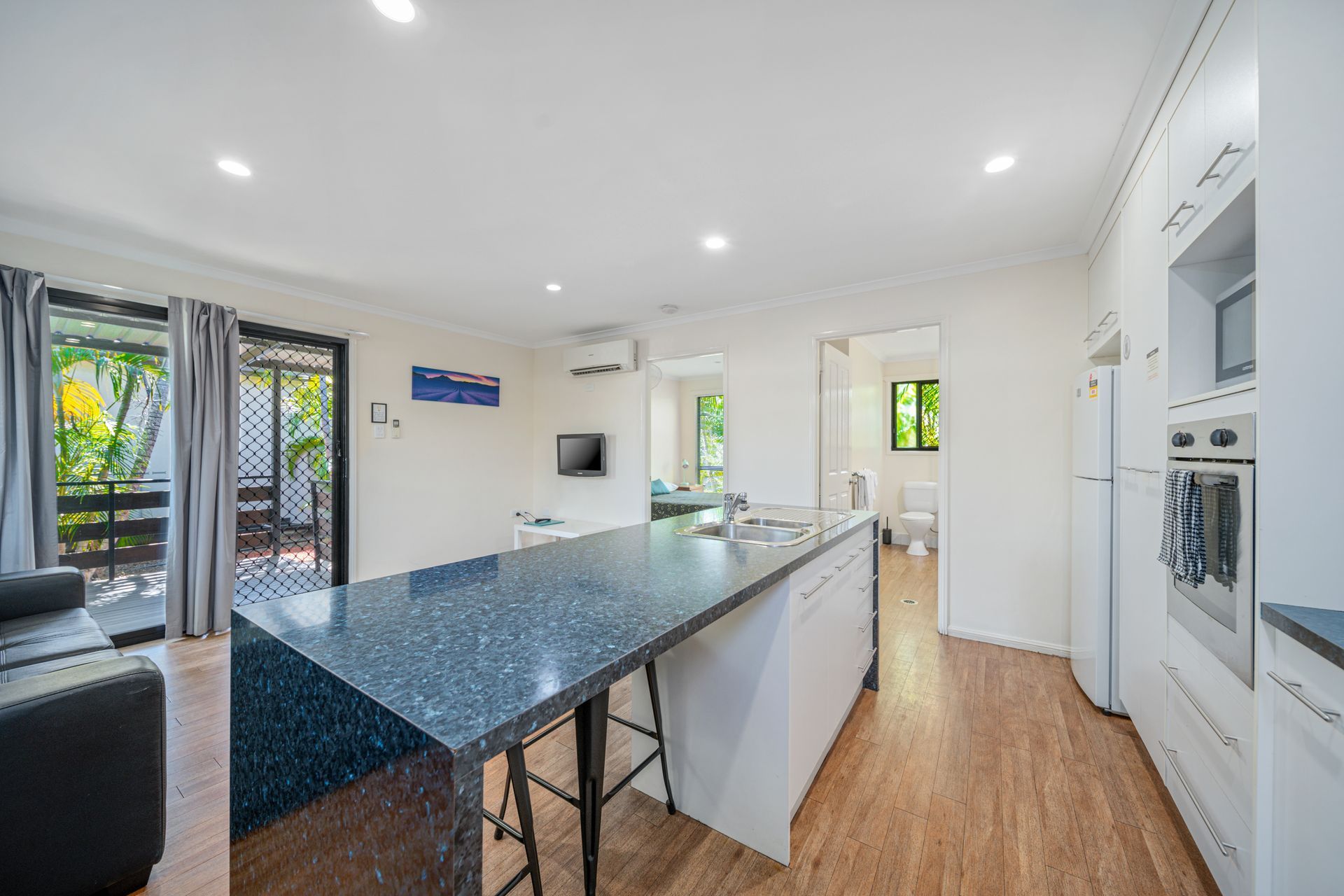 A kitchen with a large island in the middle of the room.