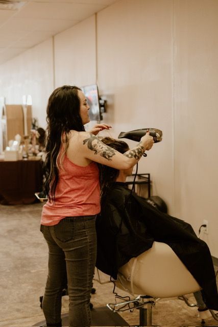 hair stylist blow drying hair | Springfield salon