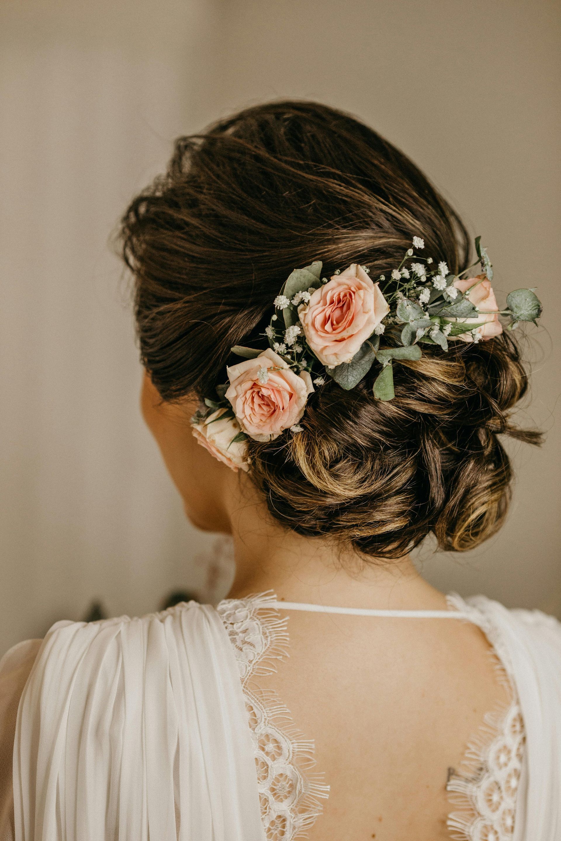 bridal hair updo with flowers | Bridal hair and makeup stylists in Springfield MO