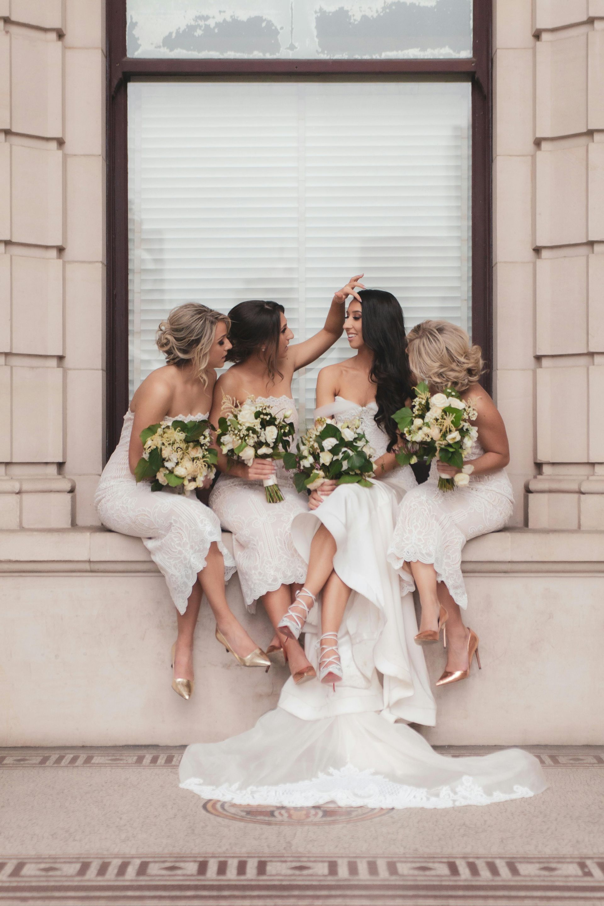 bridesmaids with bride laughing | bridesmaid hair stylist in Springfield MO
