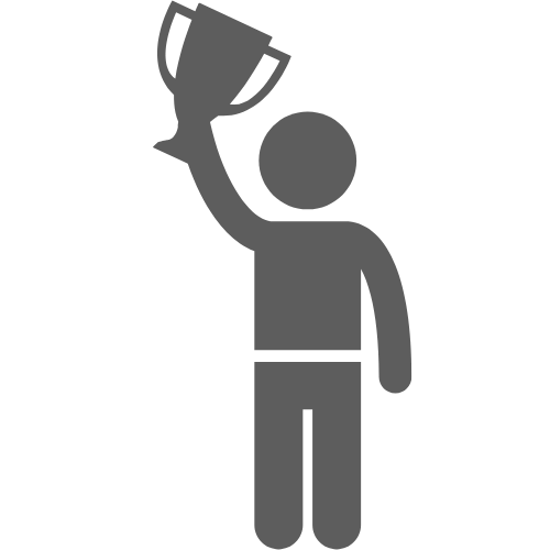 A man is holding a trophy in his hand.