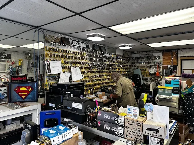 A man is working in a locksmith shop.