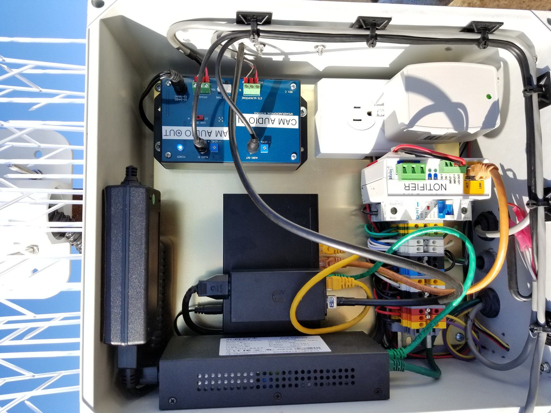 The inside of a box with a lot of wires connected to it