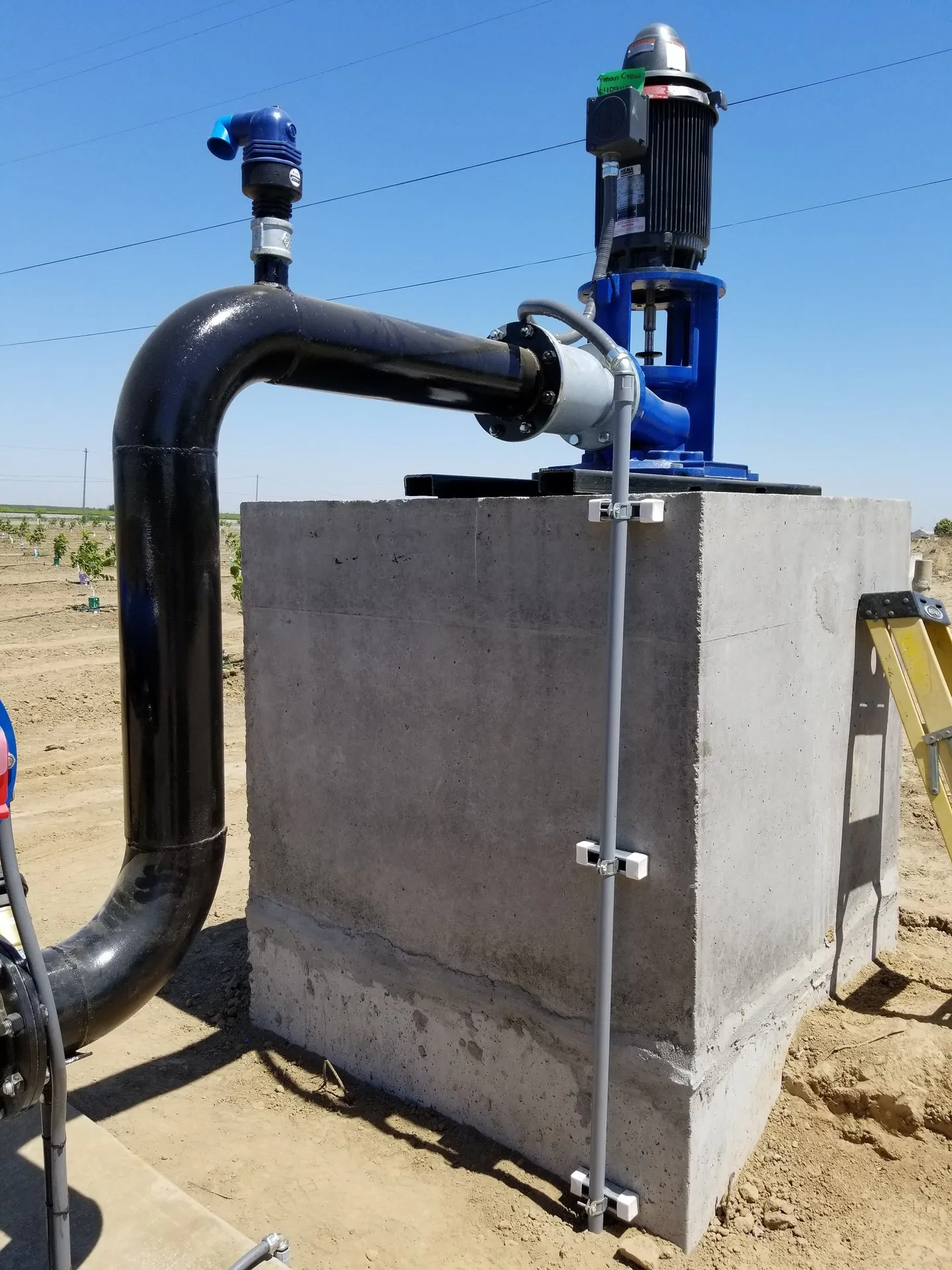 A concrete block with a pipe attached to it