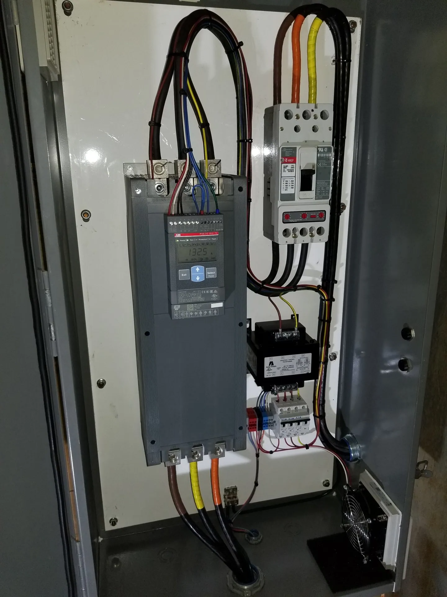 A electrical box with a lot of wires coming out of it.