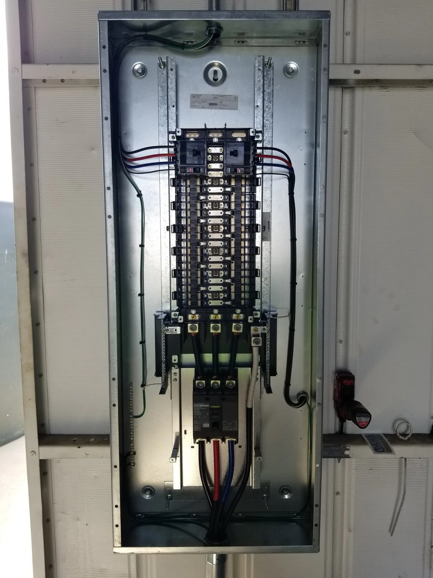 A electrical box with a lot of wires coming out of it