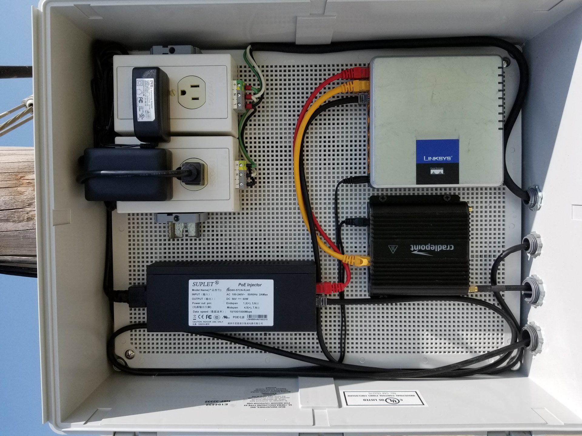 A box with a lot of wires coming out of it