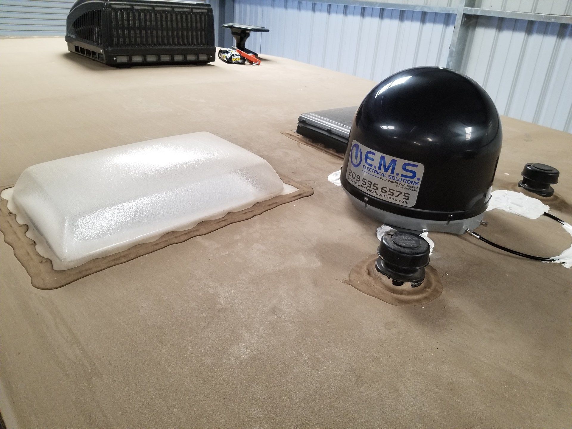A black helmet is sitting on top of a wooden table.