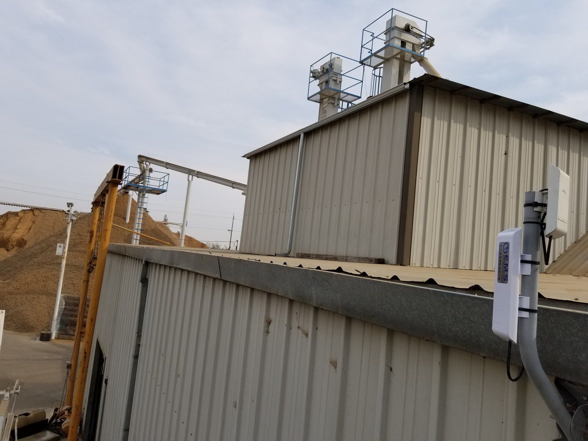 A large building with a crane in front of it