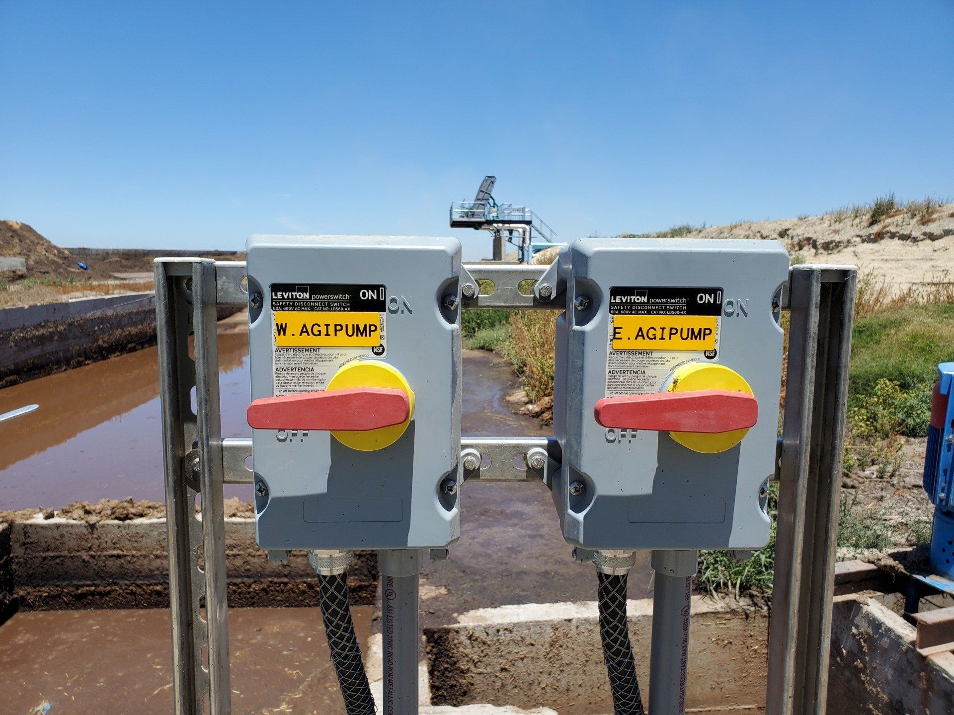 A couple of electrical switches with red and yellow handles