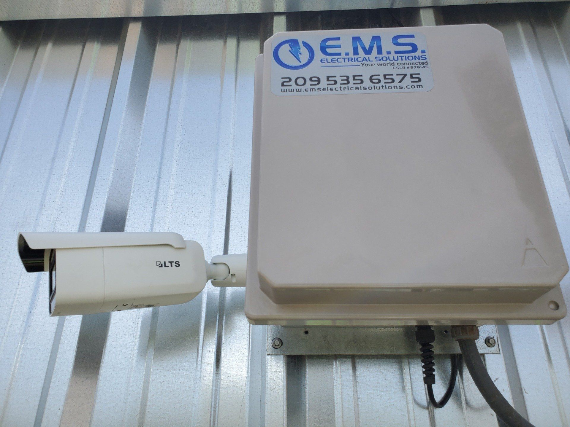 A security camera and panel installed by EMS