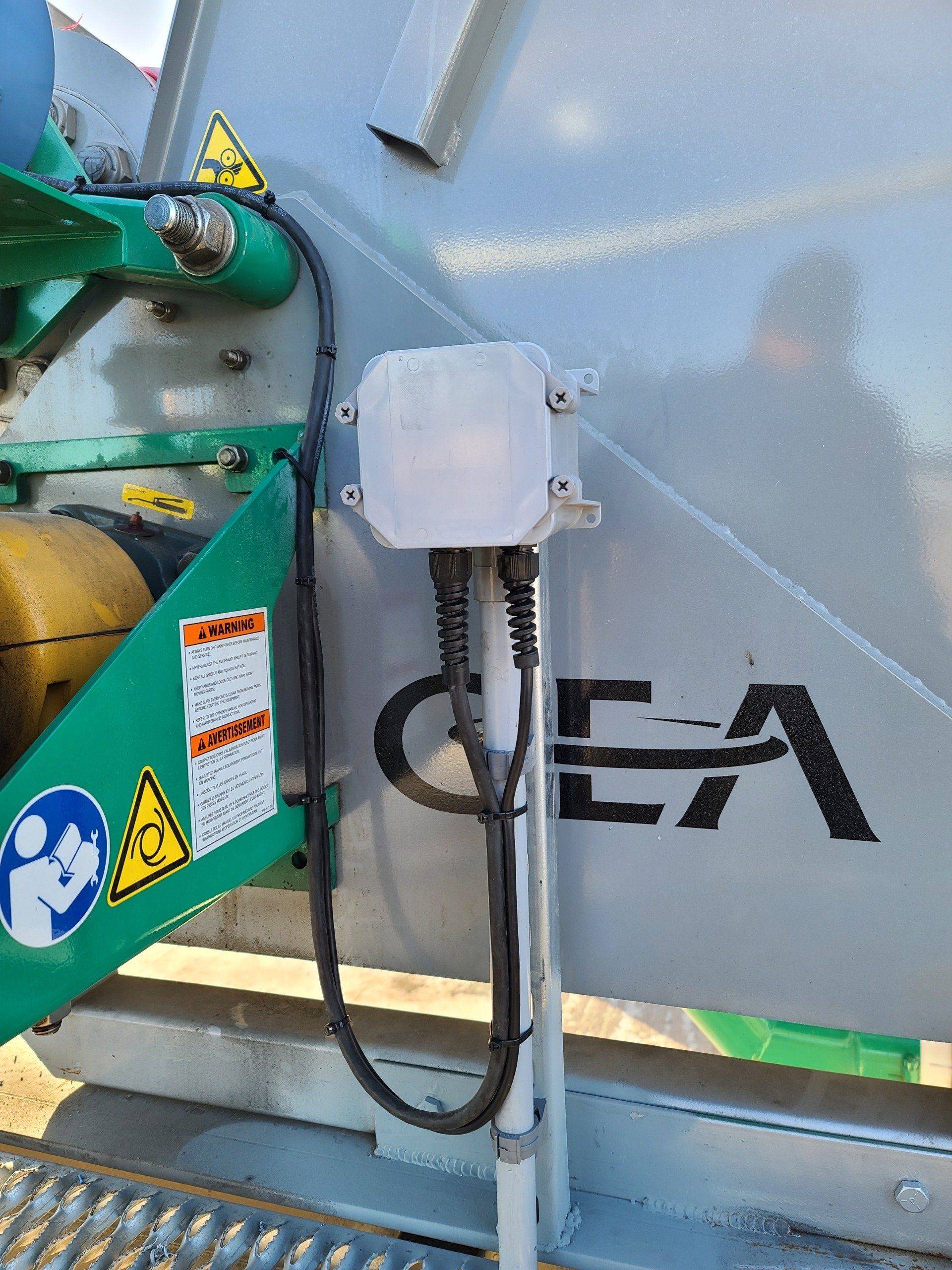 A close up of a machine with a box on it.