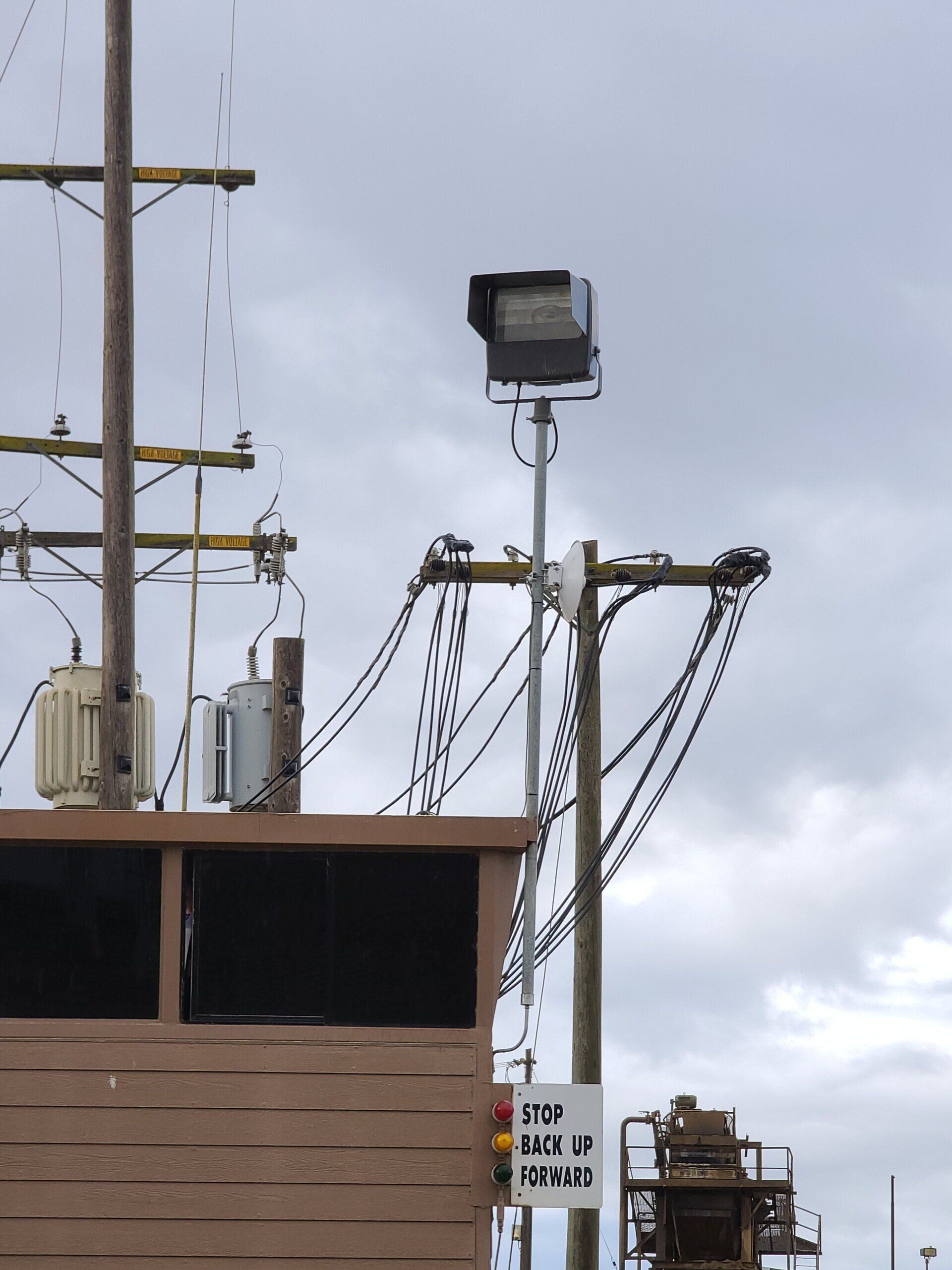 A telephone pole with a sign that says no parking on it