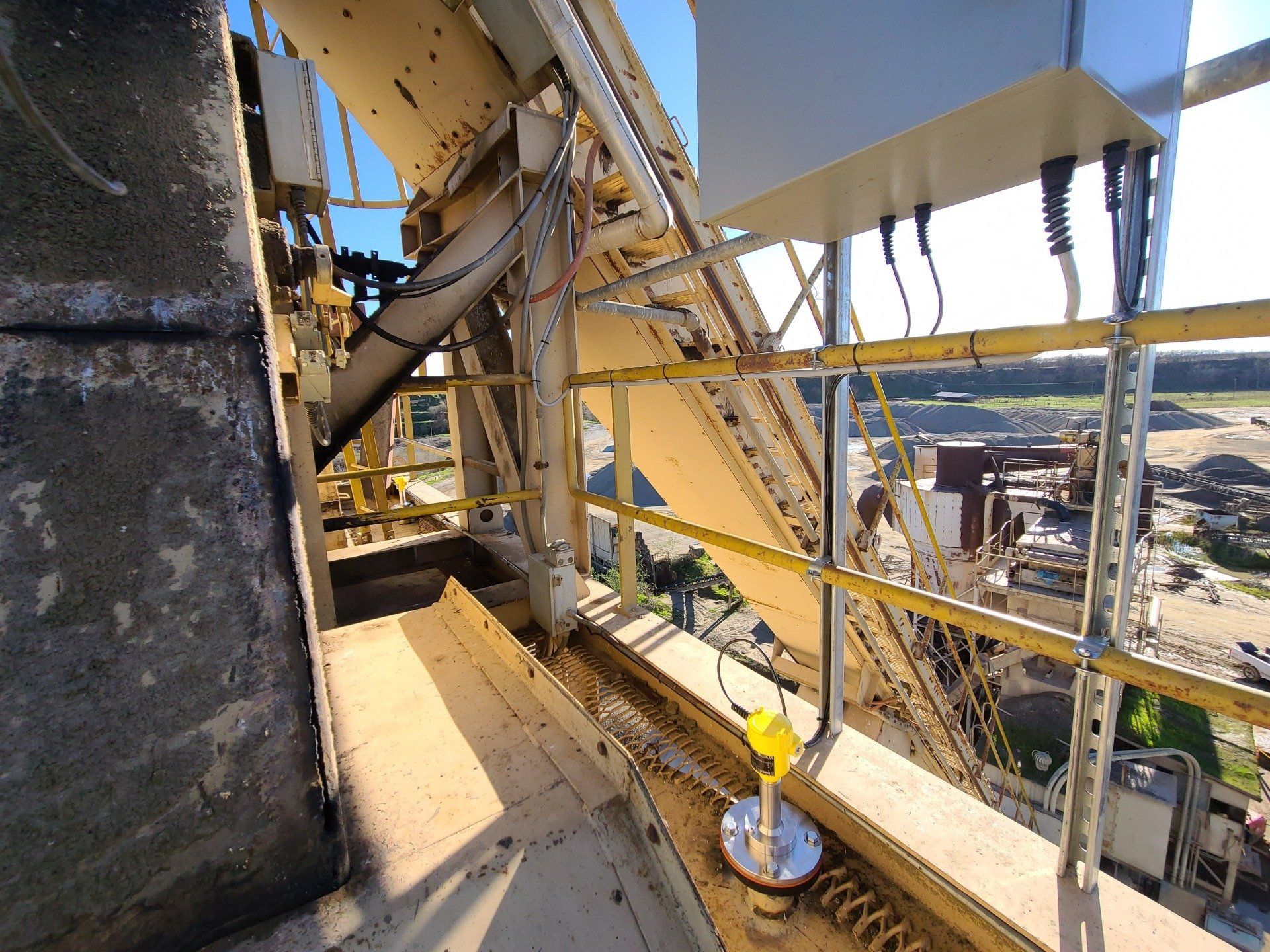 An aerial view of a building with a yellow railing