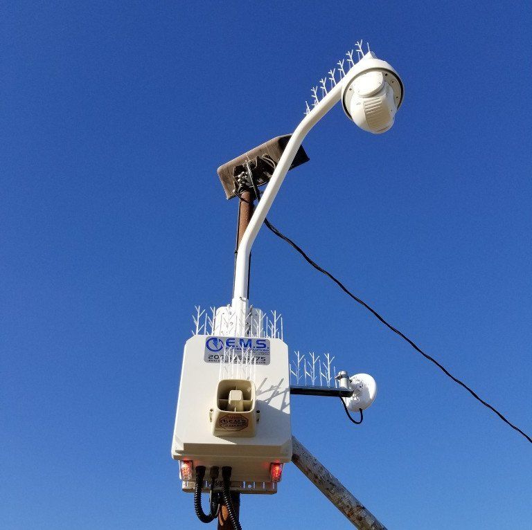 A white box with EMS Logo on it