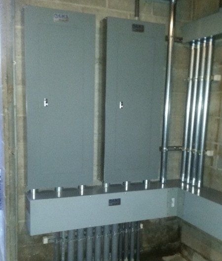 A room with a lot of electrical boxes and pipes