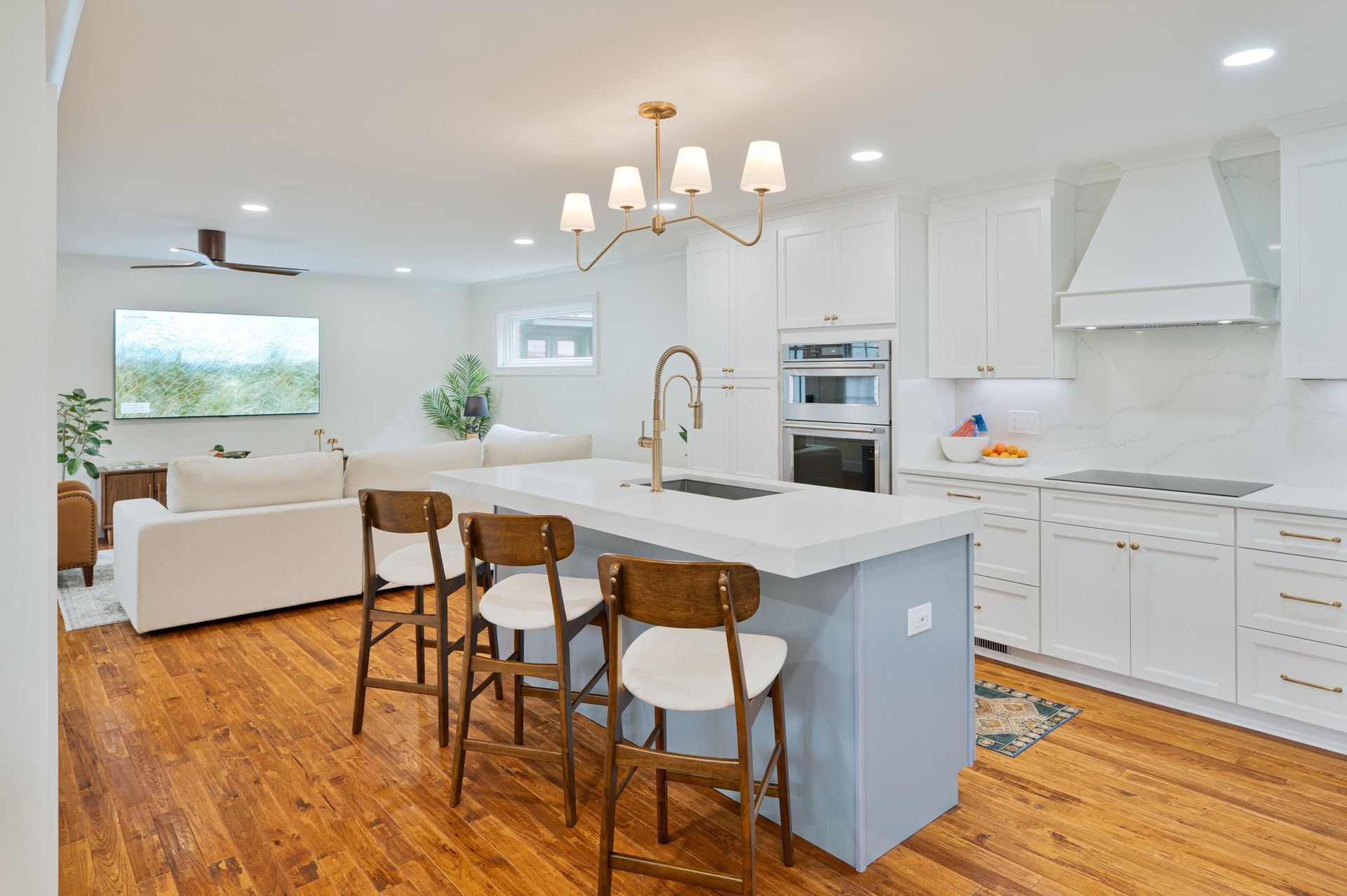 A white house with a roof that has a lot of wires coming out of it.