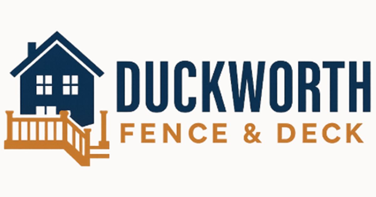 Exterior of green buildings, with gravel and yard work equipment in foreground.