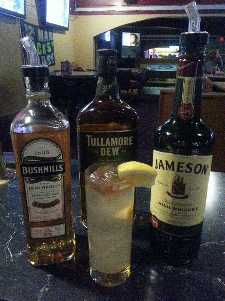 A bottle of jameson sits next to a bottle of tullamore dew