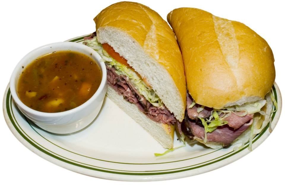 A sandwich and a bowl of soup on a plate