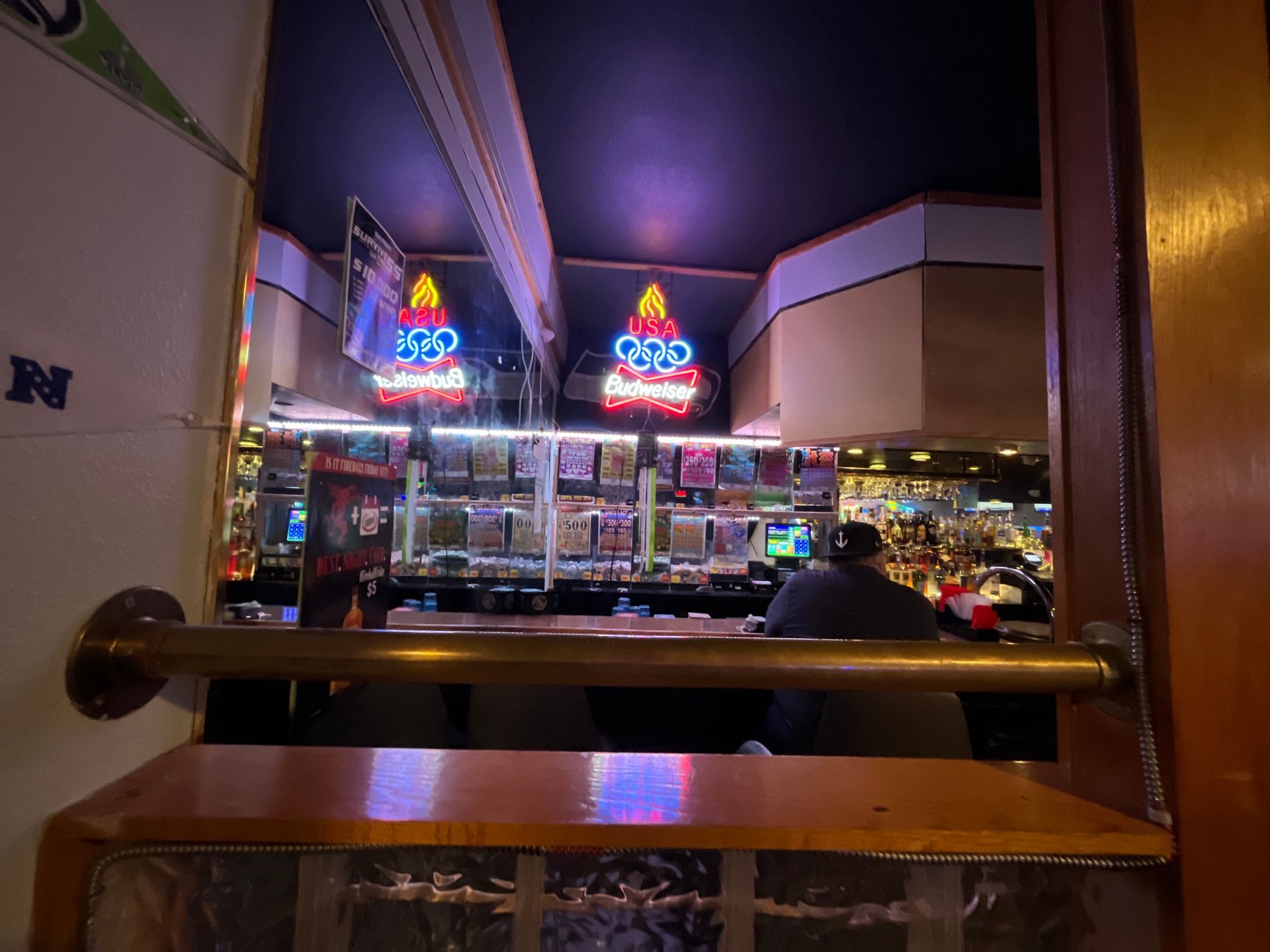 A bar with a sign that says budweiser on it