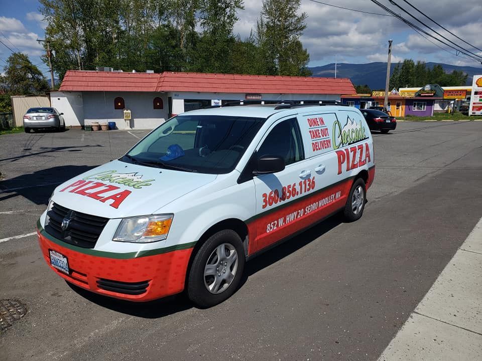 A Cascade Pizza delivery van in the parking lot